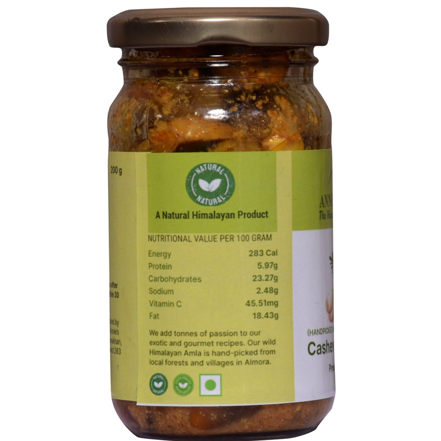 A glass jar of A Natural Himayun Product Kasuri Masala, featuring a brown lid and a light green label with nutritional details, set against a plain white background.